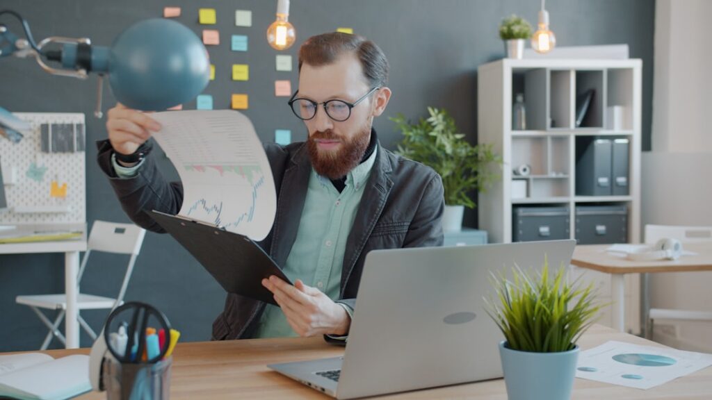 Business owner comparing offshore hiring options at a desk