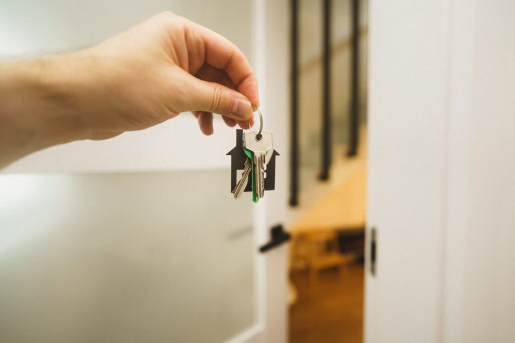 Real estate agent handing over keys after a property settlement