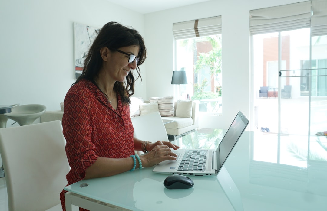 Virtual assistant working remotely at a home office computer
