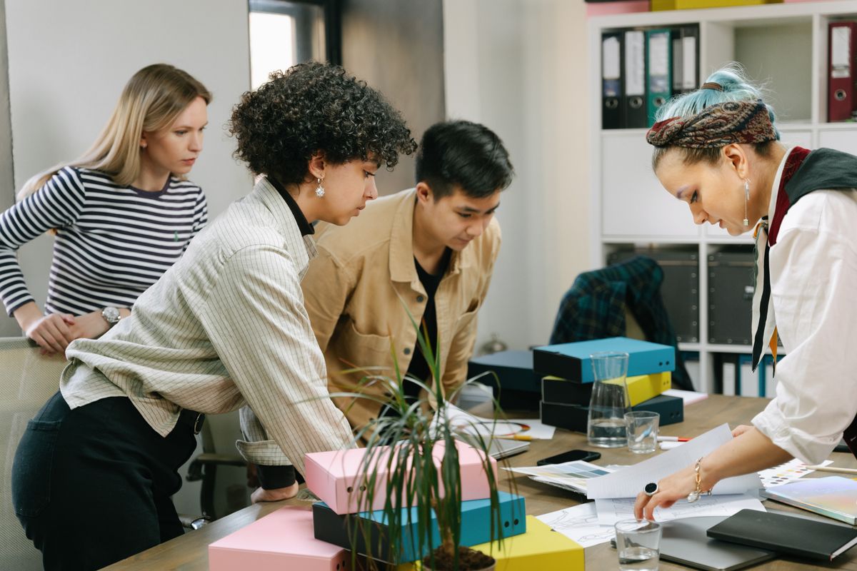 Business owner and assistant reviewing work together
